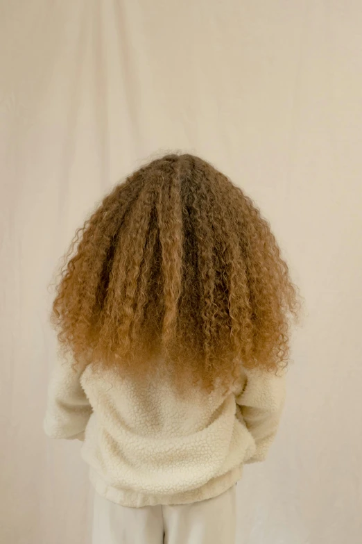 the back view of a child's fluffy sweater