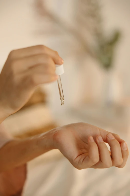 a woman is holding an electronic device in her hand