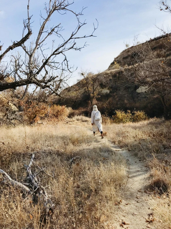 a person that is standing in the grass