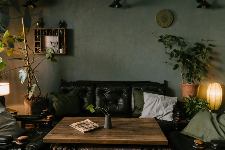 a living room has an old leather couch and table