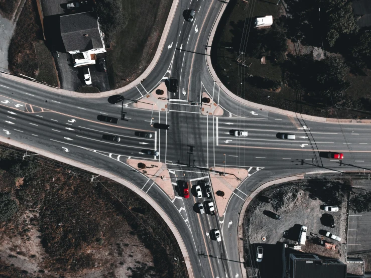 a city intersection with overhead cars and street view