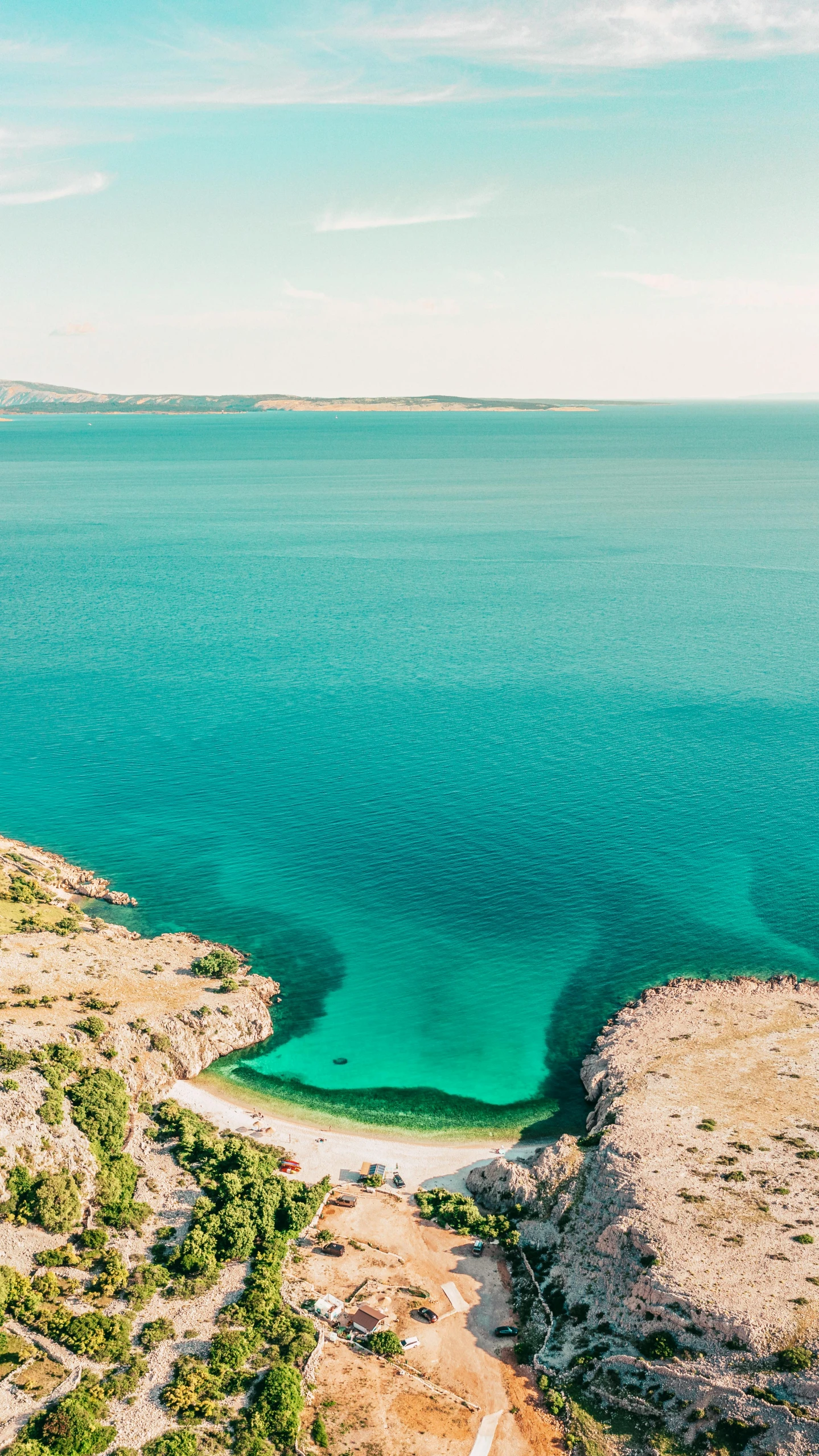 an aerial view of a sandy coastline on a clear day