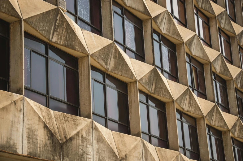 an office building has many windows and large blocks