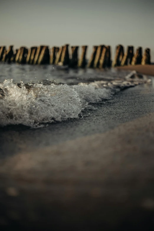 an image of waves coming to shore in the middle of a beach