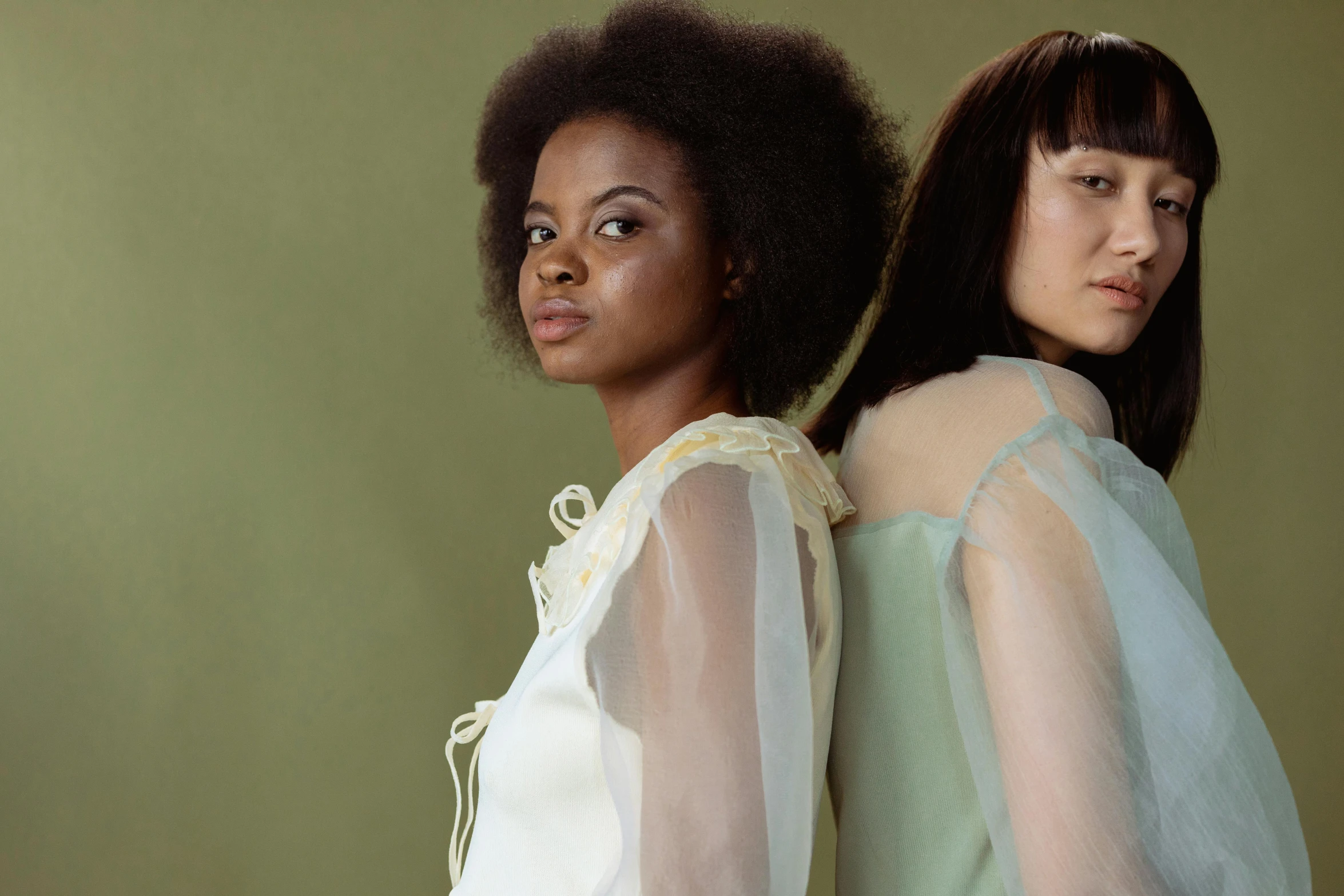 two young women dressed in white are pographed