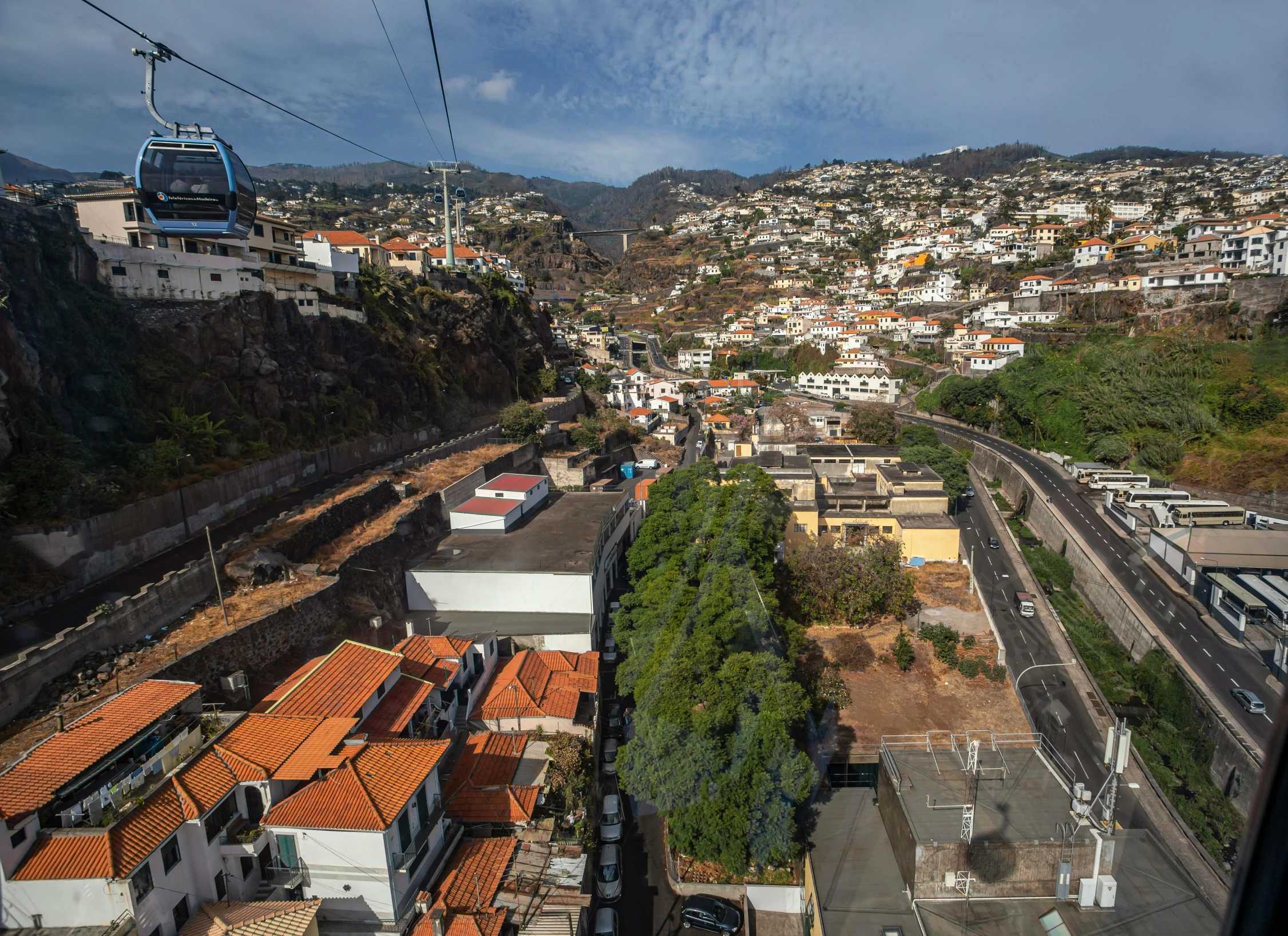 a city with a view of a train on the tracks