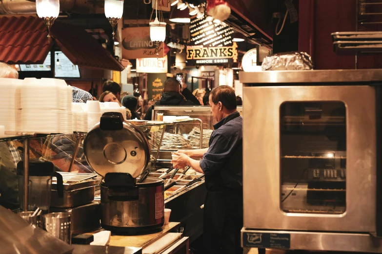 a restaurant kitchen filled with food and cooking equipment