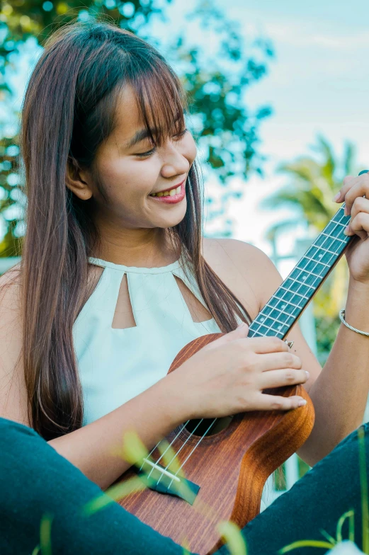 a young woman playing a musical instrument