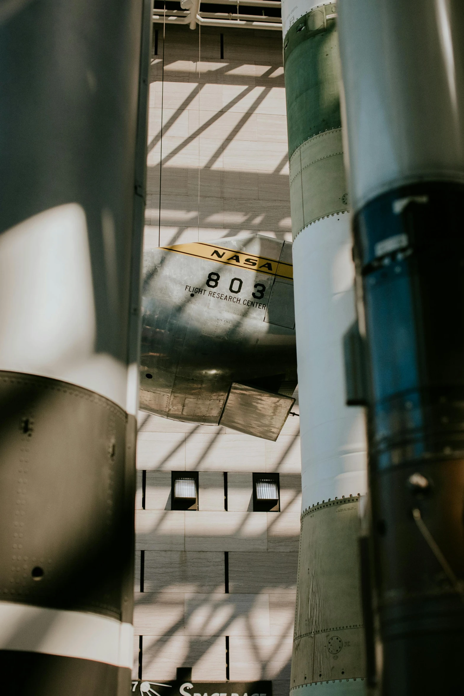 the tail end of an airplane as seen from below