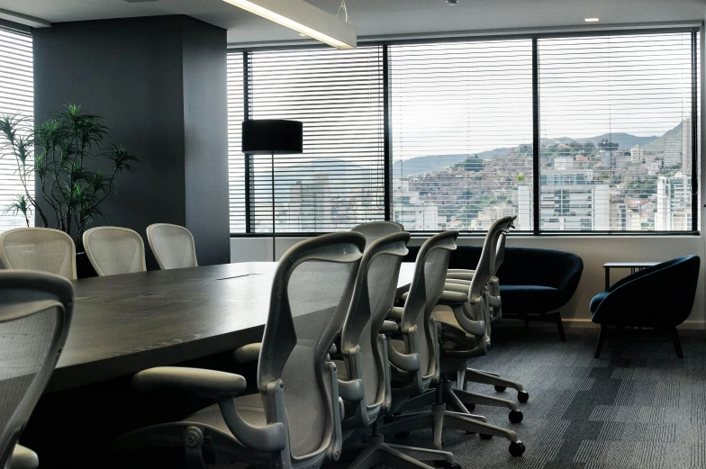 a large conference table with many chairs in a conference room