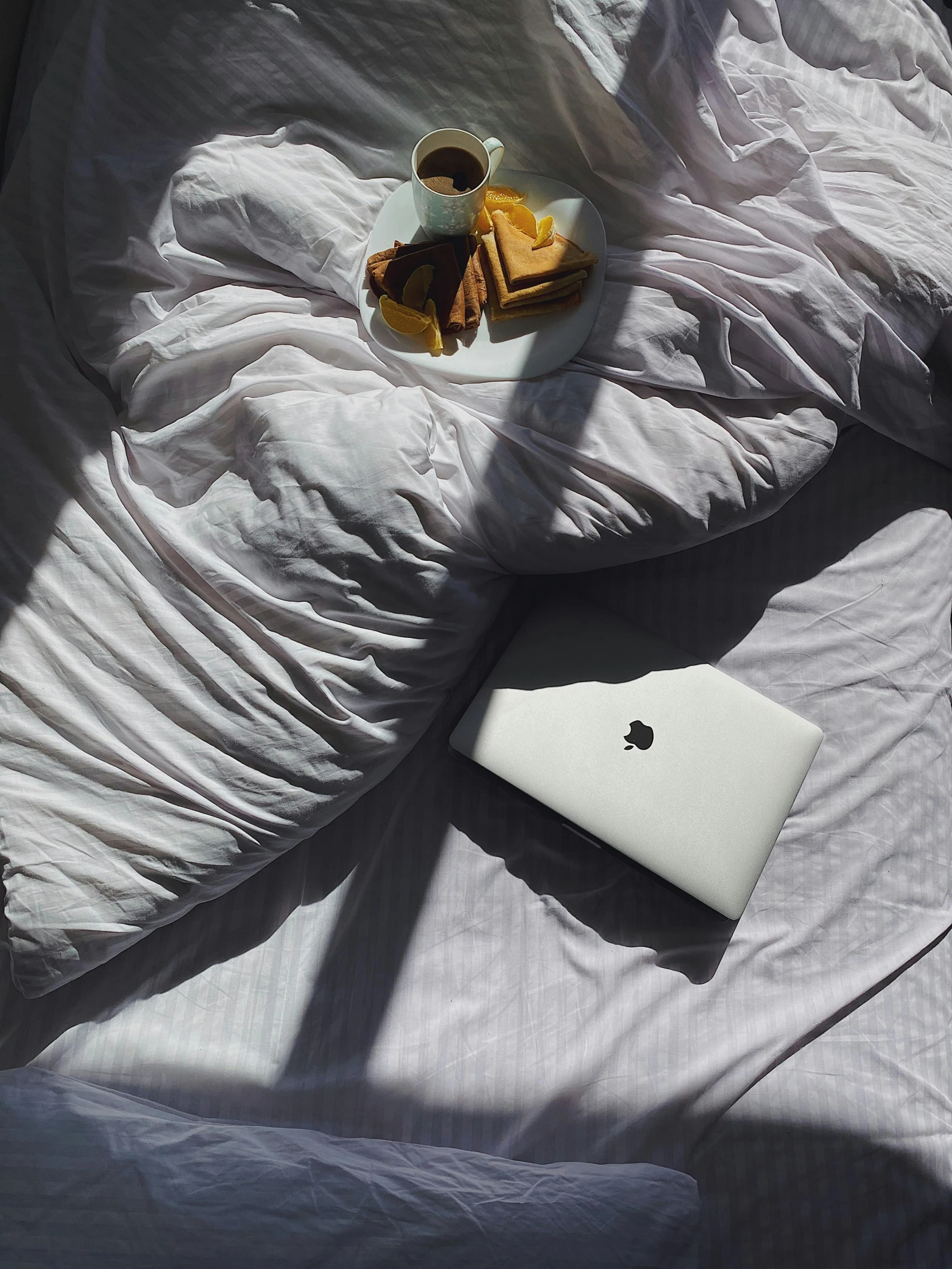 a white bed with some items on it