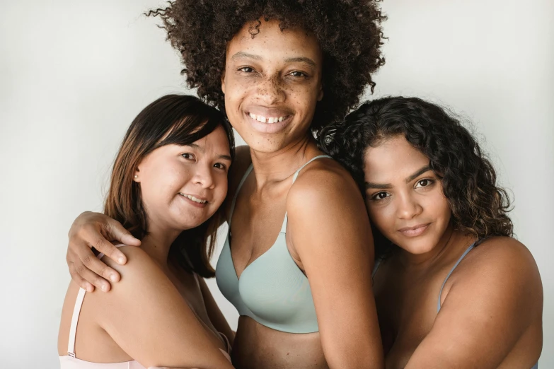 two girls in matching s hugging and smiling for a picture