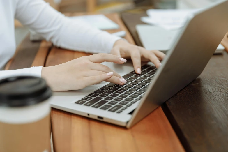 a person using a laptop on a table