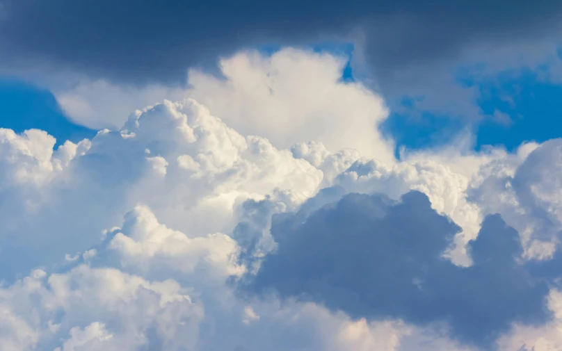 a big white cloud that has some blue sky