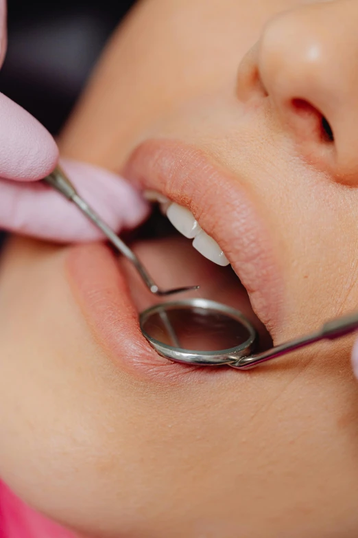 a woman with a surgical device on her nose getting a new one