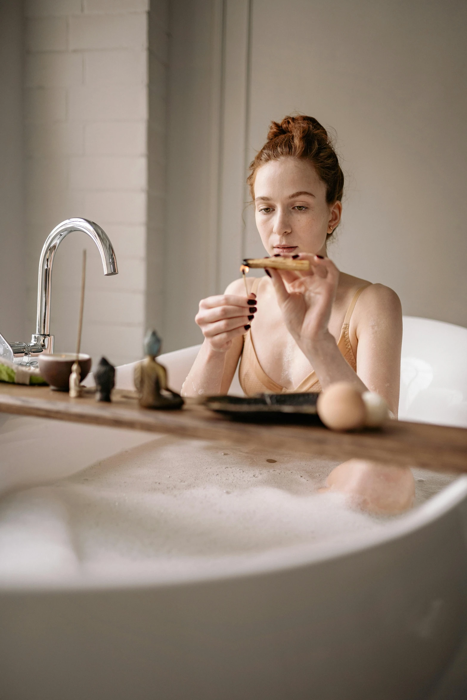 a woman is drinking from the bowl in the bathroom