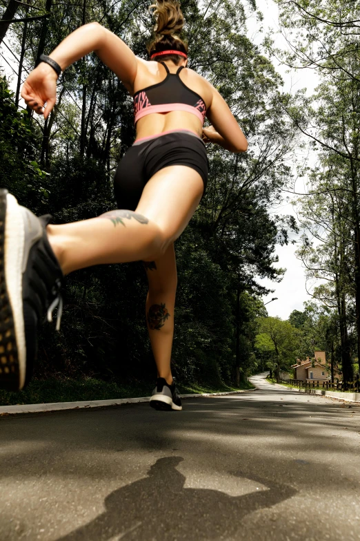 a beautiful young woman running down the street