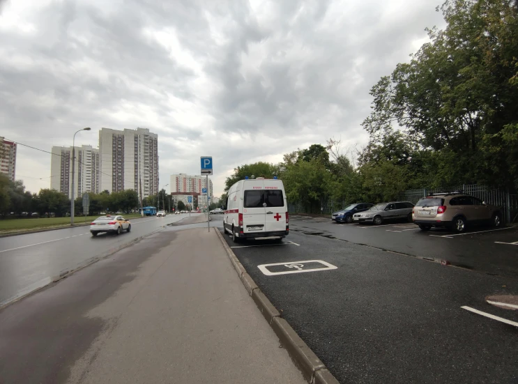 cars drive down a rainy highway with a bus on the side