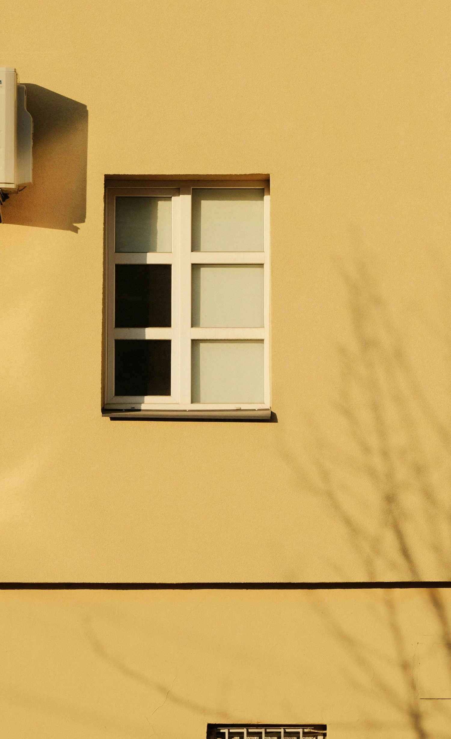 a window with no glass and a street light below it