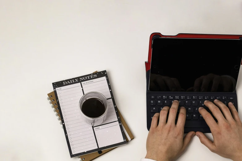 a person with their hand on a keyboard