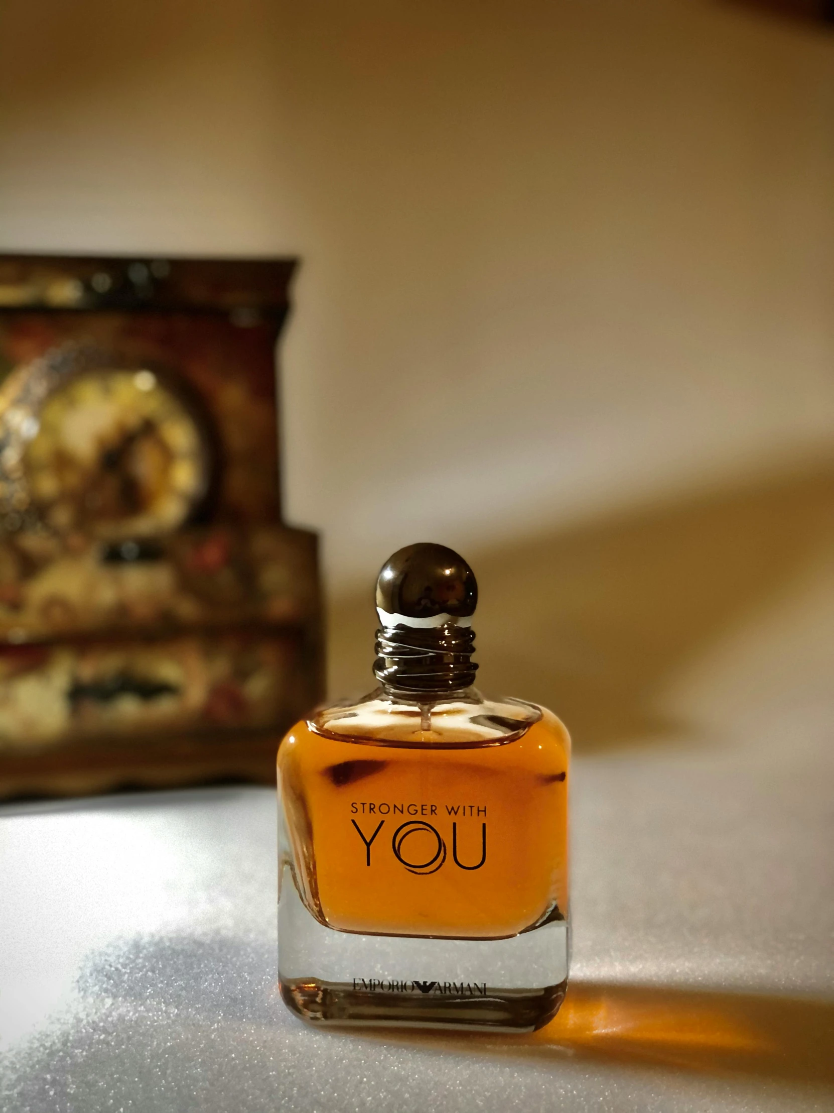 a bottle of perfume sitting on top of a table