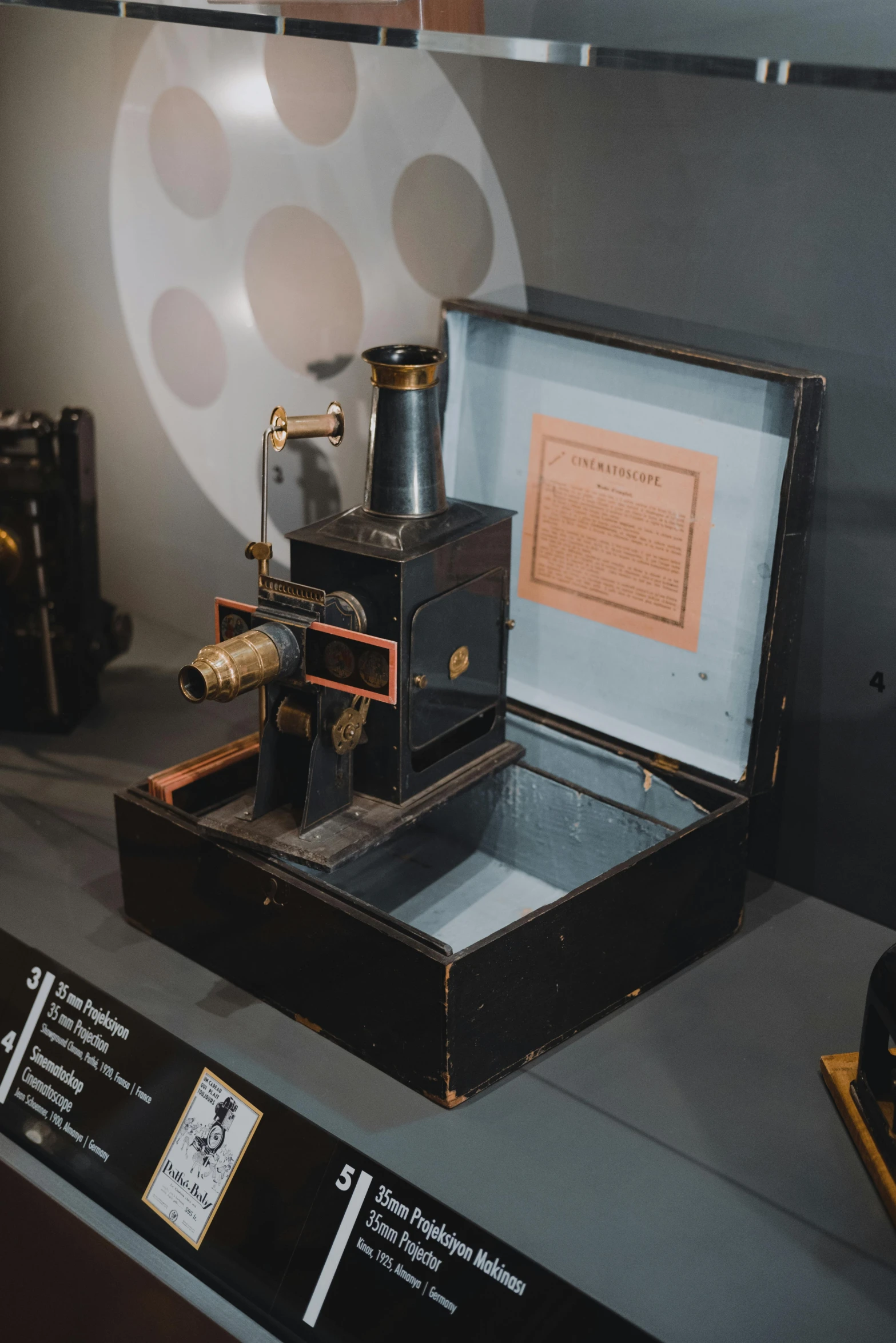 an antique microscope being displayed in a museum exhibit