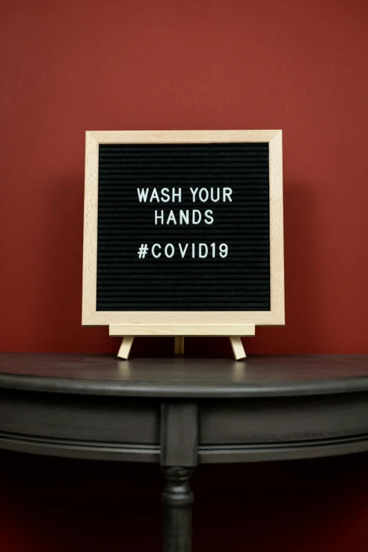 a sign with words on it says wash your hands covid19