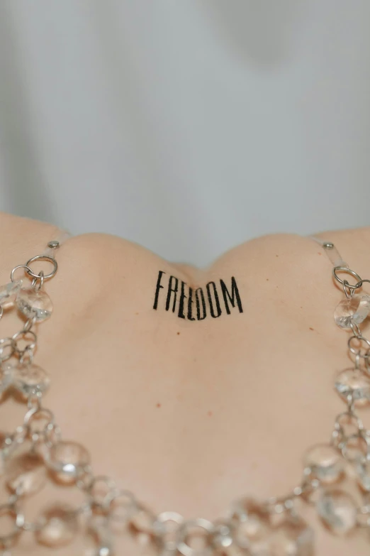 someone has written the word fribom on their chest