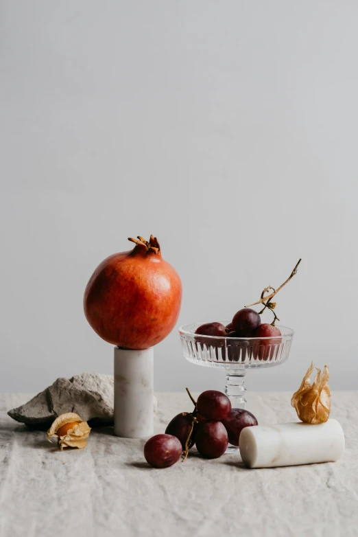 a fruit bowl with gs, a mushroom and a piece of paper