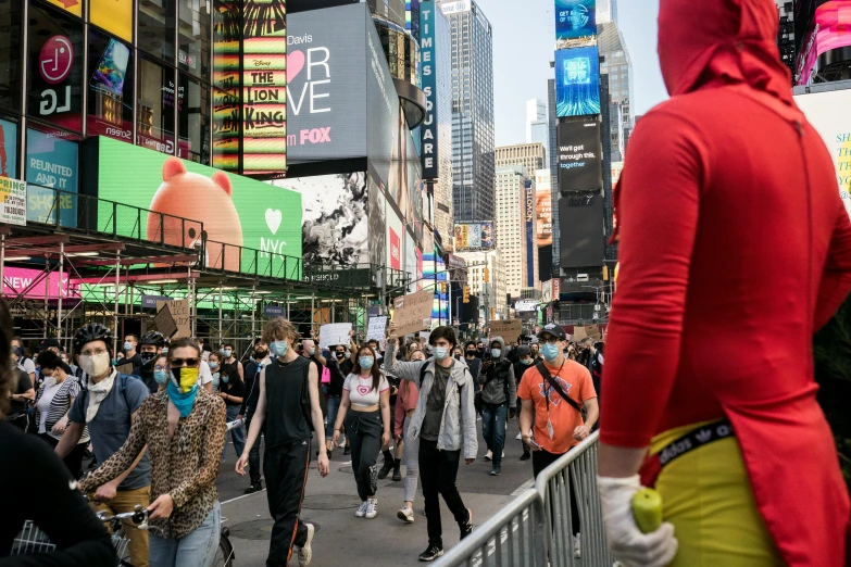 several people walking down the street together