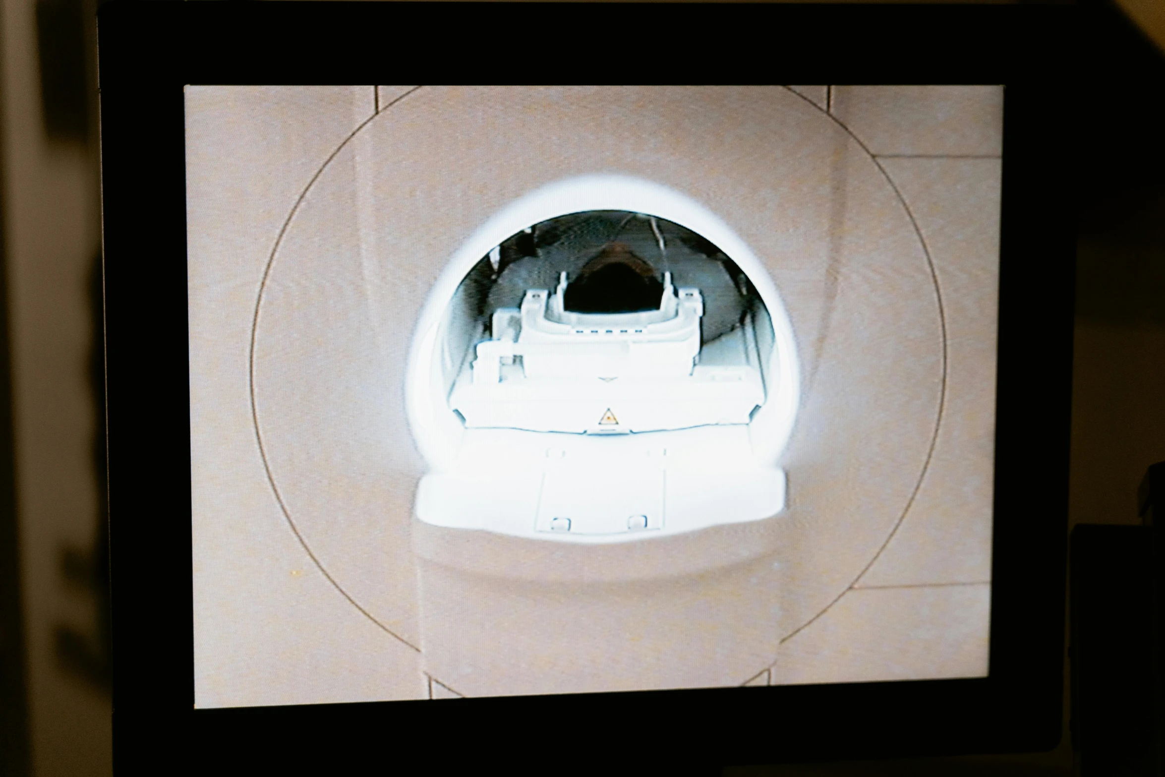 the flat screen television is showing a view of a circular object