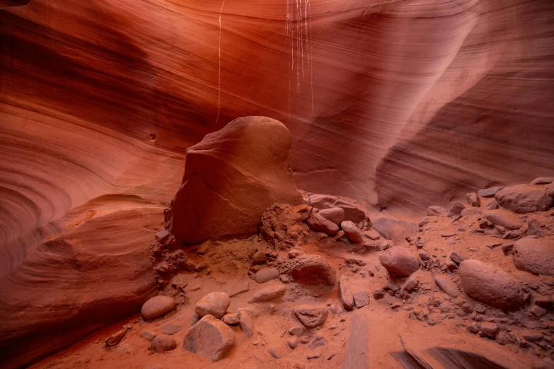 an empty desert filled with a rock formation