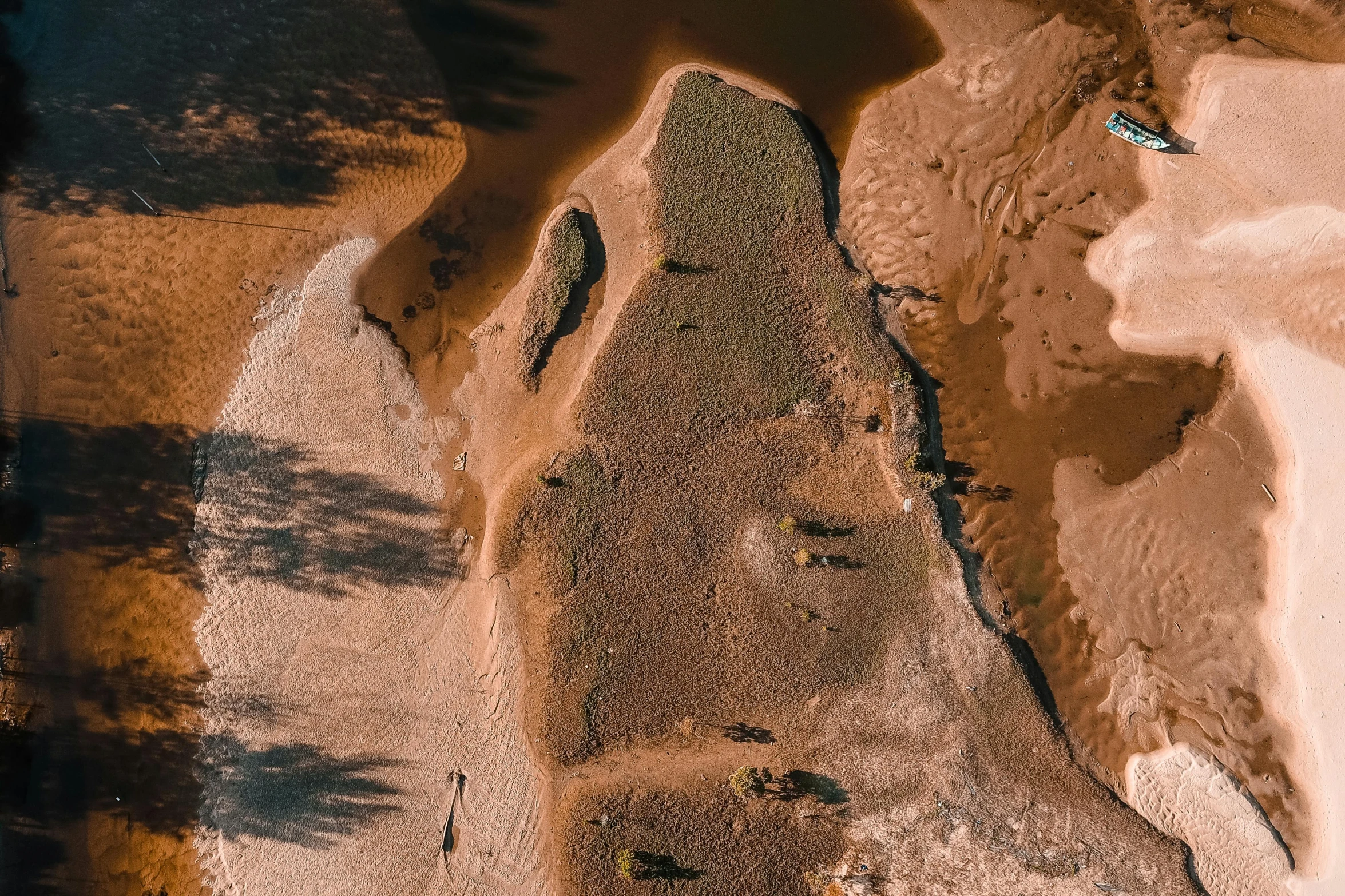 water flowing over sand and rocks in the ocean