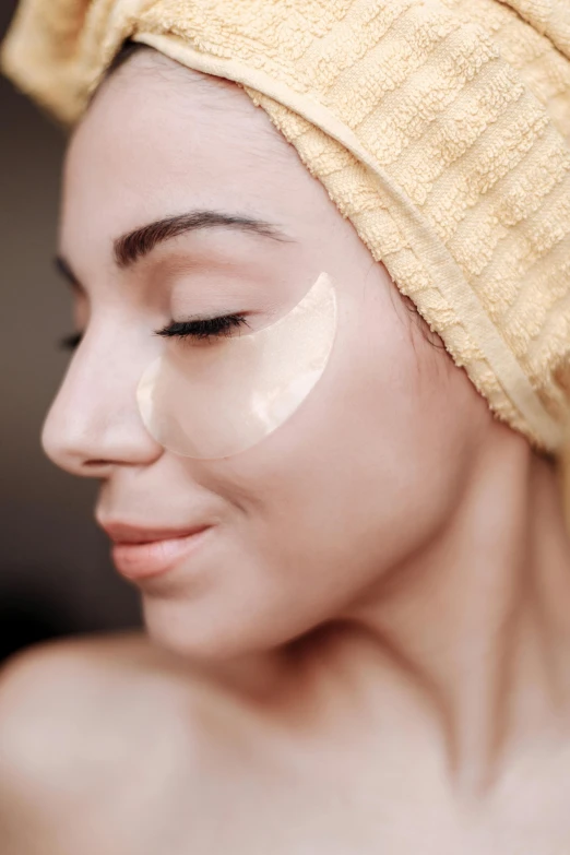 a young woman with a plastic eye patch on her face