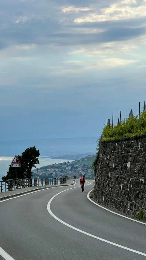 a motorcyclist on a winding road in the country