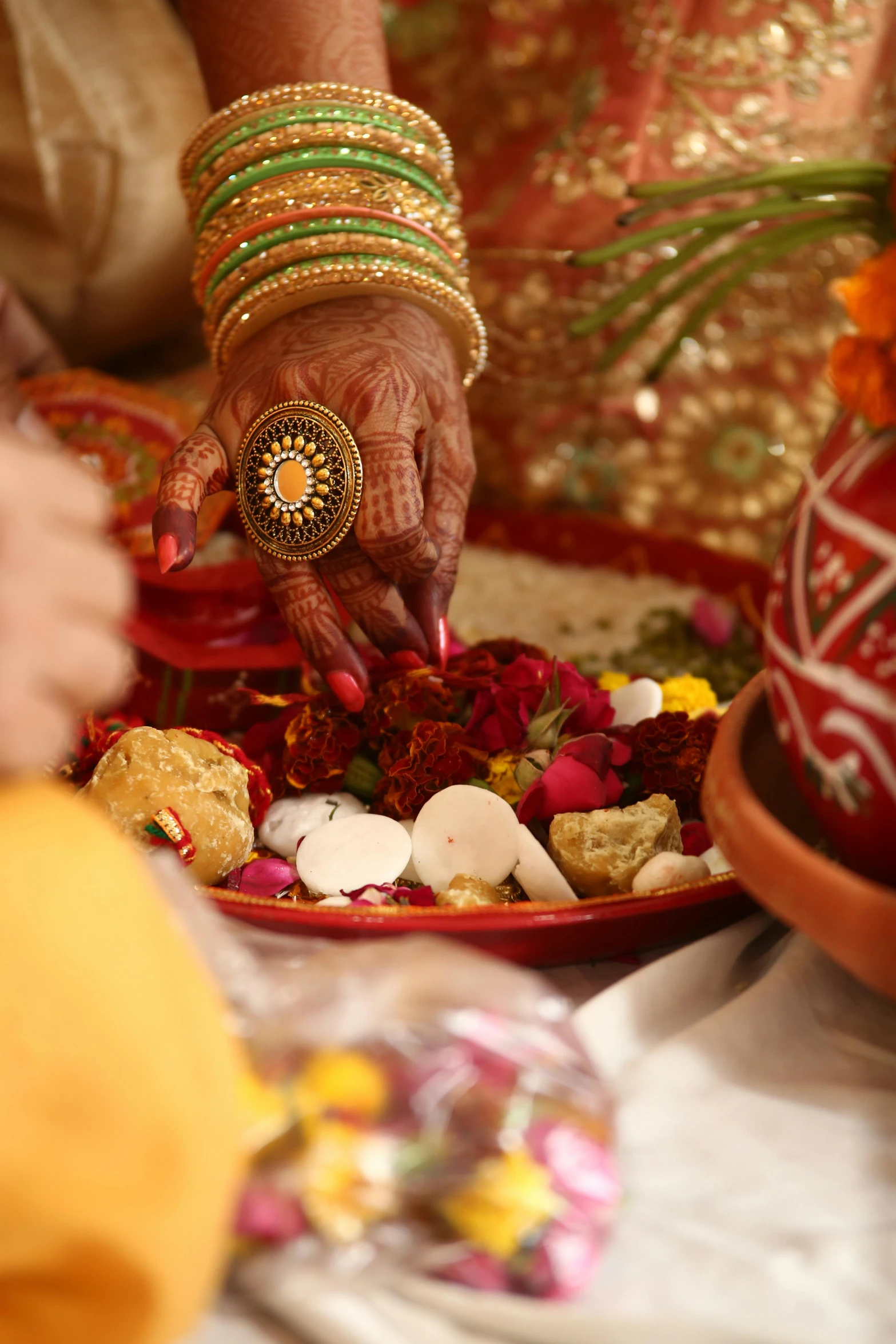 two women doing soing with their hands and holding another hand