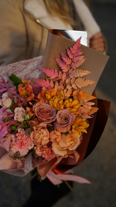 a person holding a bouquet of flowers