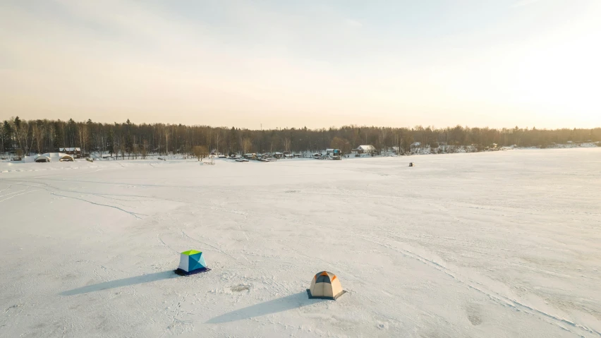 two surfboards are sitting in the snow