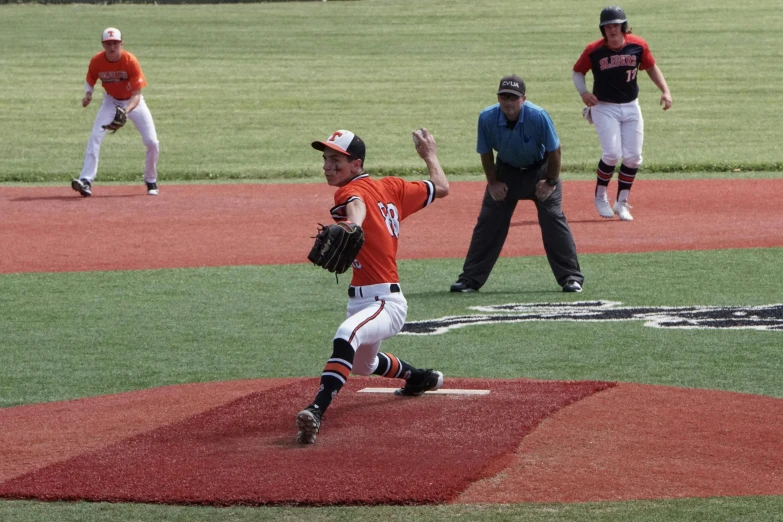 baseball player about to pitch the ball in a game