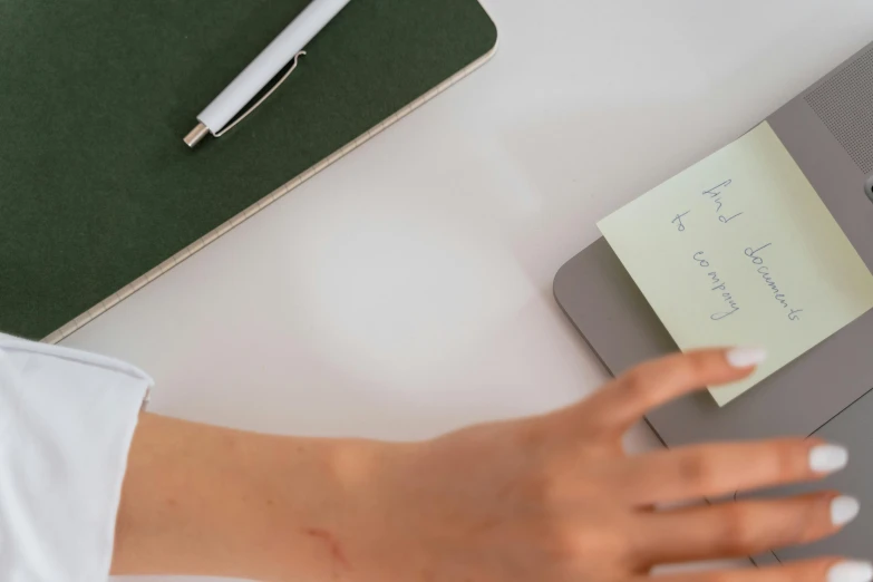 an open notebook on top of a table with writing