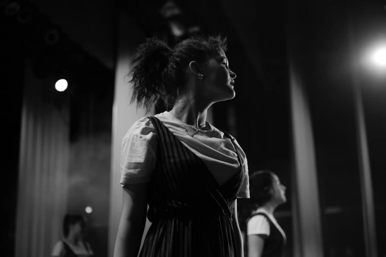 an image of a woman on the catwalk in the dark