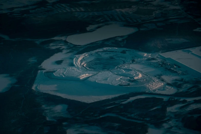 this is a po taken from a plane looking down at a large snowy area in the middle of the country