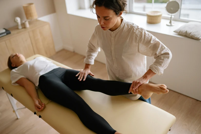 a woman doing a back massage to a man