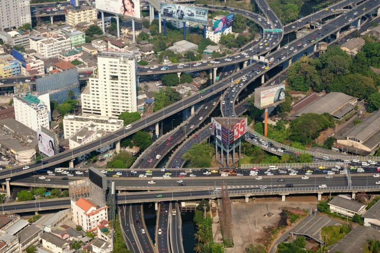 aerial view of a freeway and city with large bridges