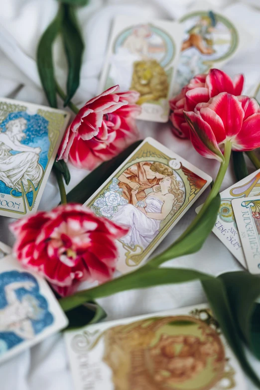 flowers sit on top of cards that have different images