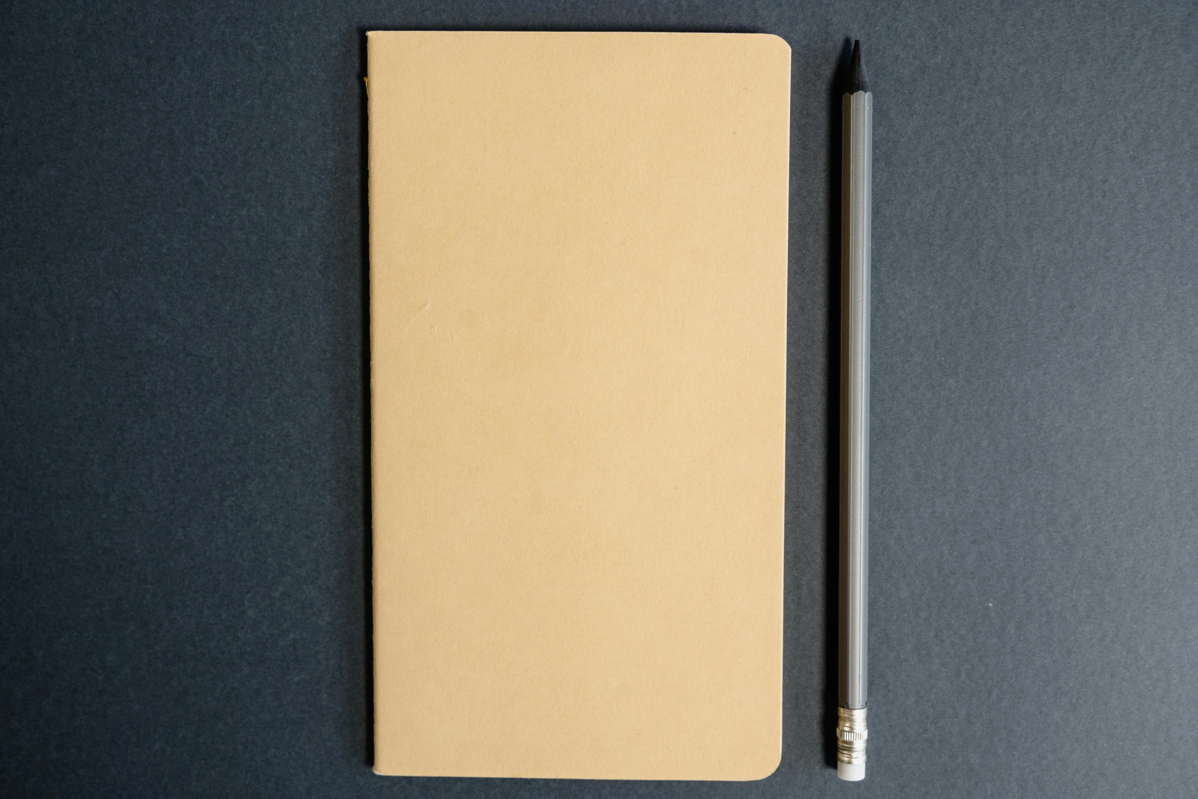 a pen is laying on top of a notebook