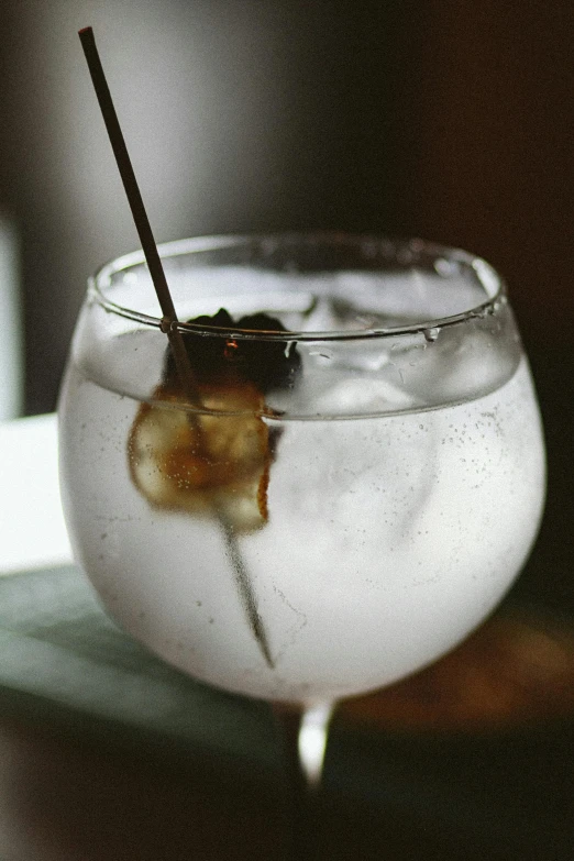 a white liquid in a glass filled with soing