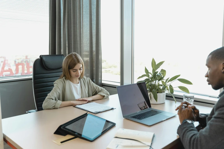 two business people working at a large table