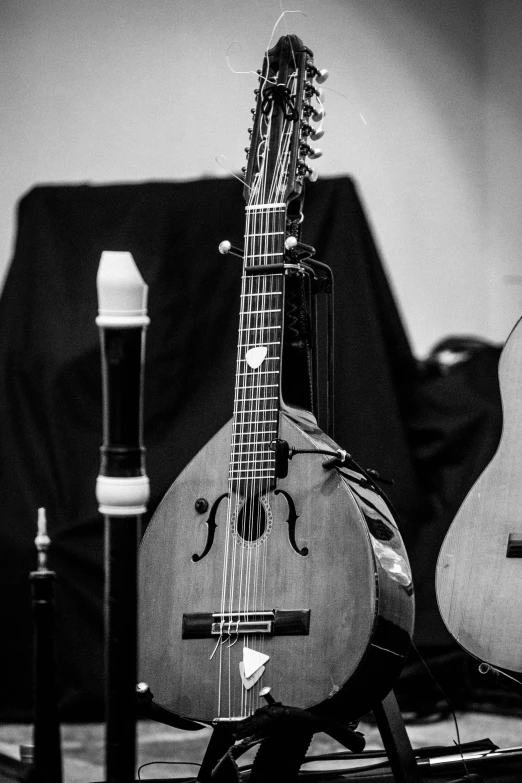 guitar sitting on top of a table in a room