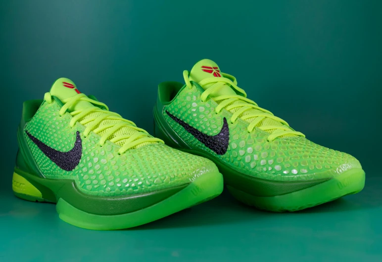 the nike hyper flyknit basketball shoe is displayed in bright lime green